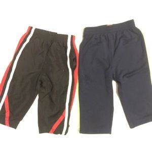 2 pairs of track pants - 12 months. Like new.